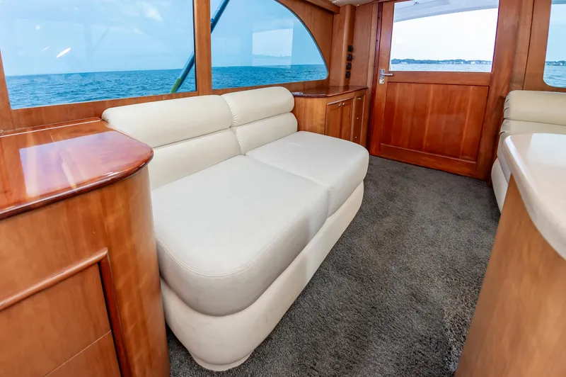 Sea Horse Yacht Photos Pics Luxurious interior of 1994 Custom Carolina 43 Blackwell Convertible yacht with ocean view.
