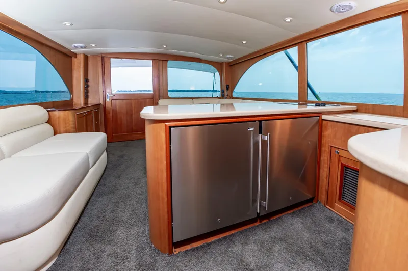 Sea Horse Yacht Photos Pics Luxurious interior of 1994 Custom Carolina 43 Blackwell Convertible yacht with ocean view.