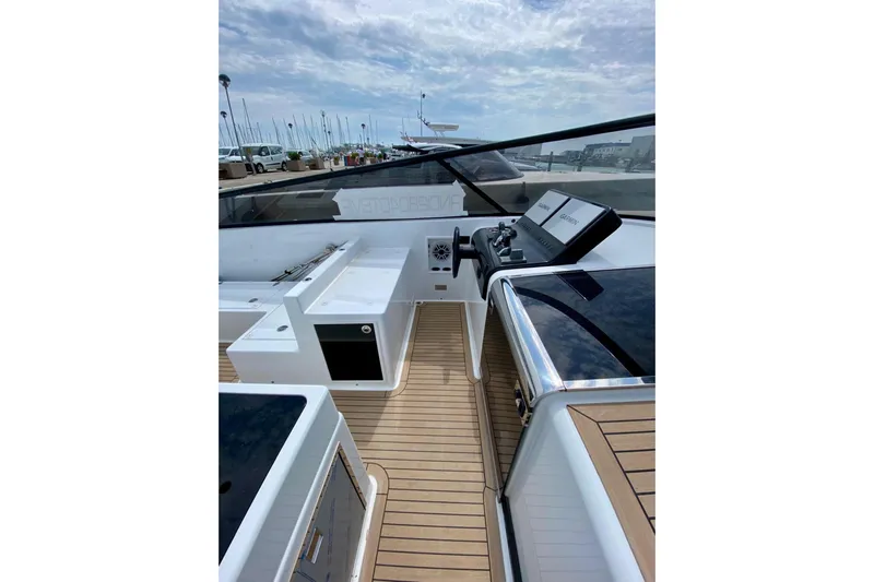  Yacht Photos Pics 2025 VanDutch 48 yacht cockpit with sleek design and modern controls.