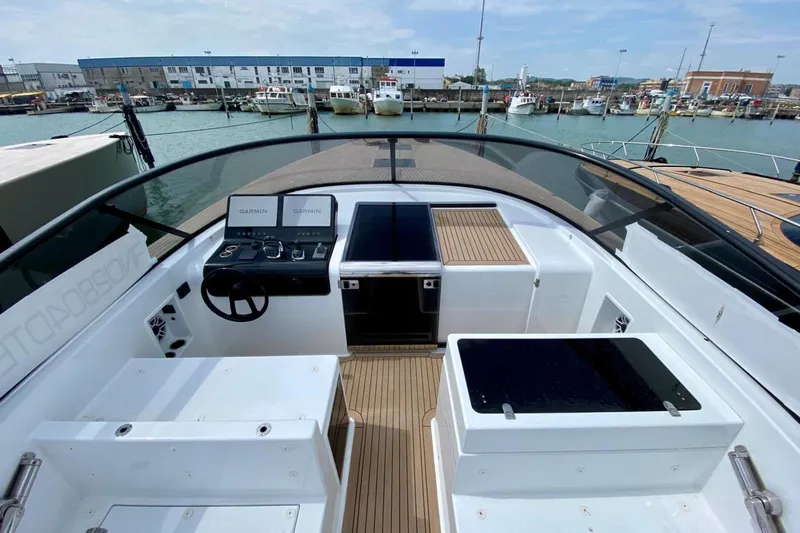  Yacht Photos Pics 2025 VanDutch 48 yacht cockpit with modern navigation systems and sleek design.