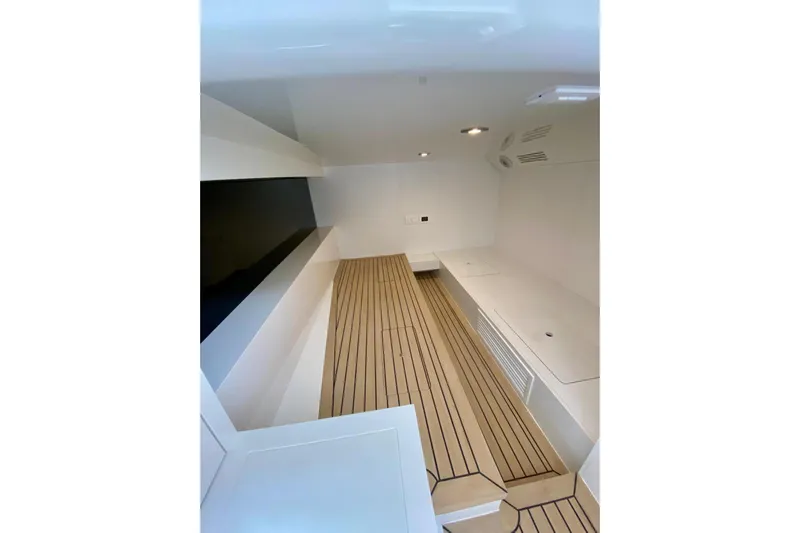  Yacht Photos Pics Interior of 2025 VanDutch 48 yacht with sleek, modern design and wooden flooring.