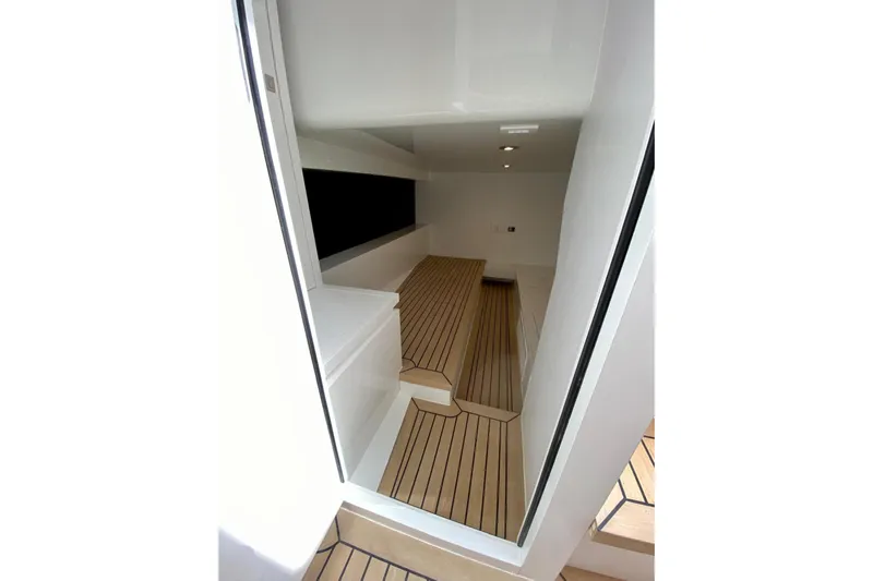  Yacht Photos Pics Interior of 2025 VanDutch 48 yacht with sleek wooden flooring and modern design.