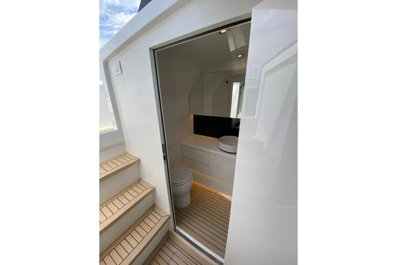  Yacht Photos Pics Luxurious bathroom interior of 2025 VanDutch 48 yacht, featuring modern fixtures and sleek design.
