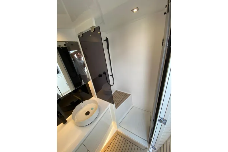  Yacht Photos Pics Luxurious bathroom interior of 2025 VanDutch 48 yacht with modern fixtures and sleek design.