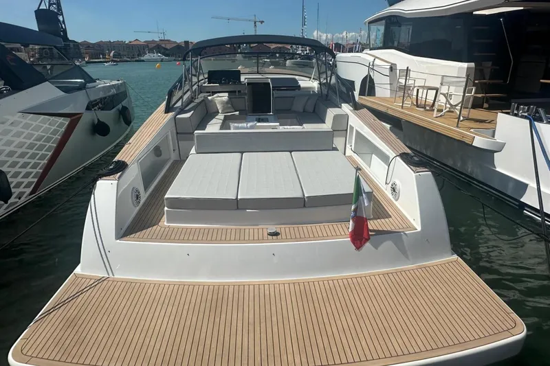  Yacht Photos Pics 2025 VanDutch 48 yacht docked, featuring sleek design and spacious deck.