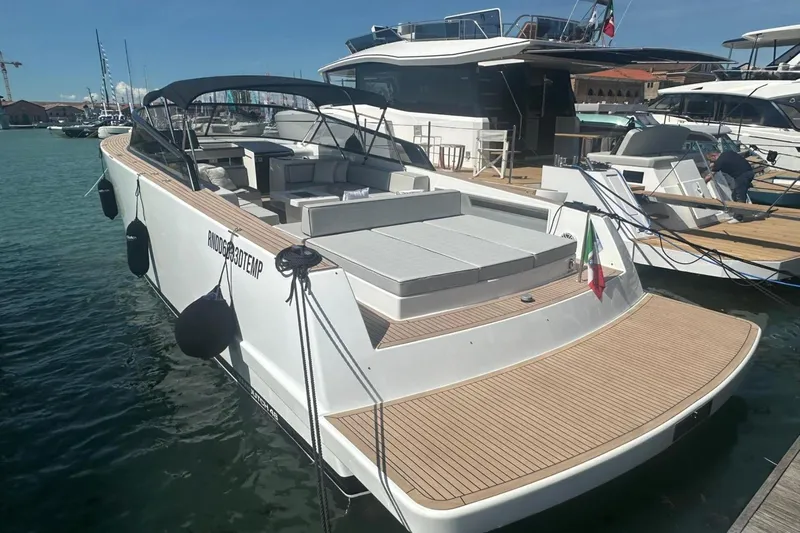  Yacht Photos Pics 2025 VanDutch 48 yacht docked, featuring sleek design and spacious deck.