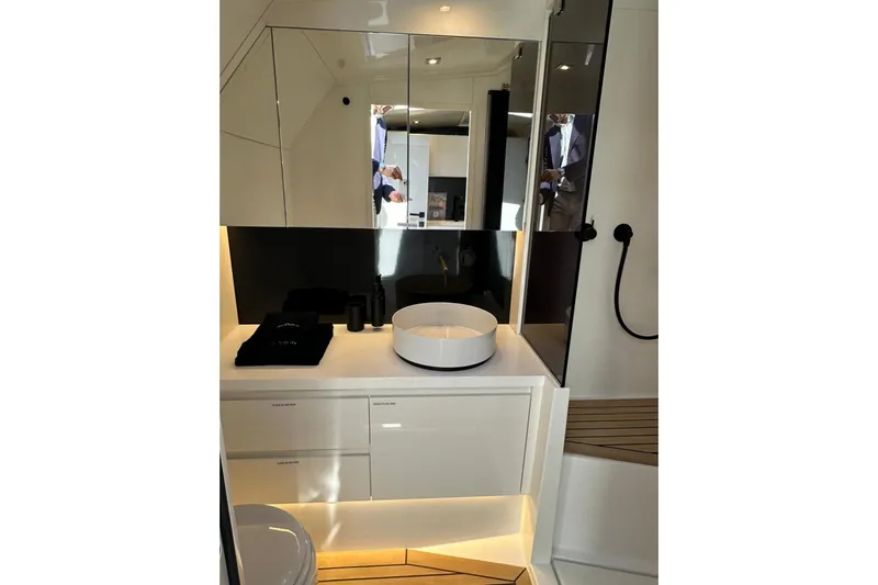  Yacht Photos Pics Luxurious bathroom interior of 2025 VanDutch 48 yacht with modern fixtures and sleek design.