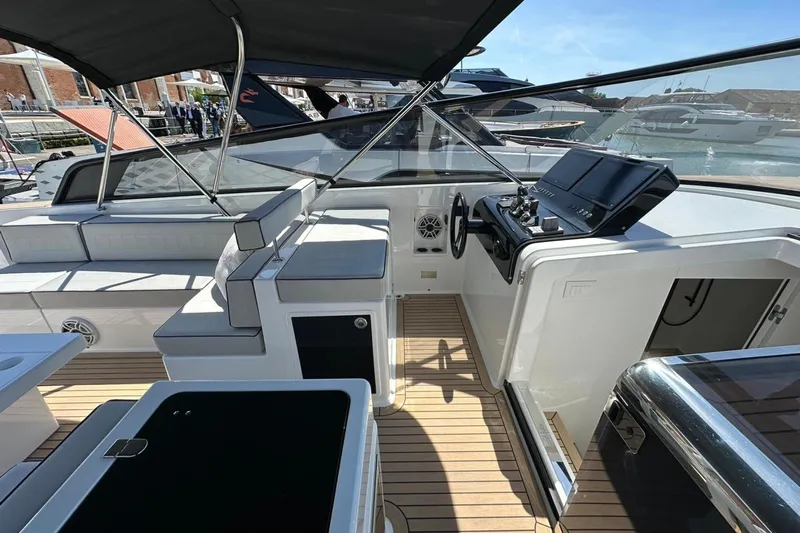  Yacht Photos Pics 2025 VanDutch 48 yacht interior with sleek design and modern controls.