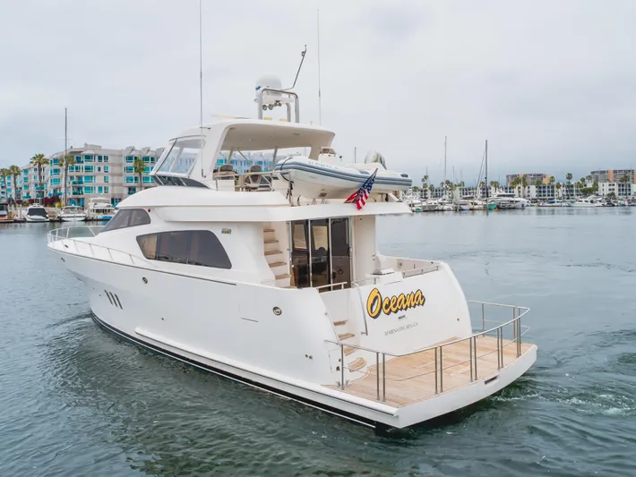 Oceana Yacht Photos Pics 2009 McKinna 60 Pilothouse yacht in marina, featuring sleek design and spacious deck.