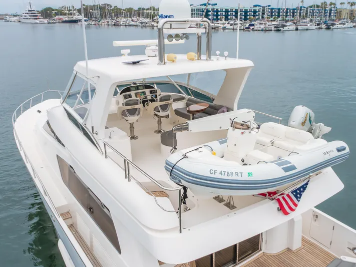Oceana Yacht Photos Pics 2009 McKinna 60 Pilothouse yacht with upper deck and tender in marina setting.
