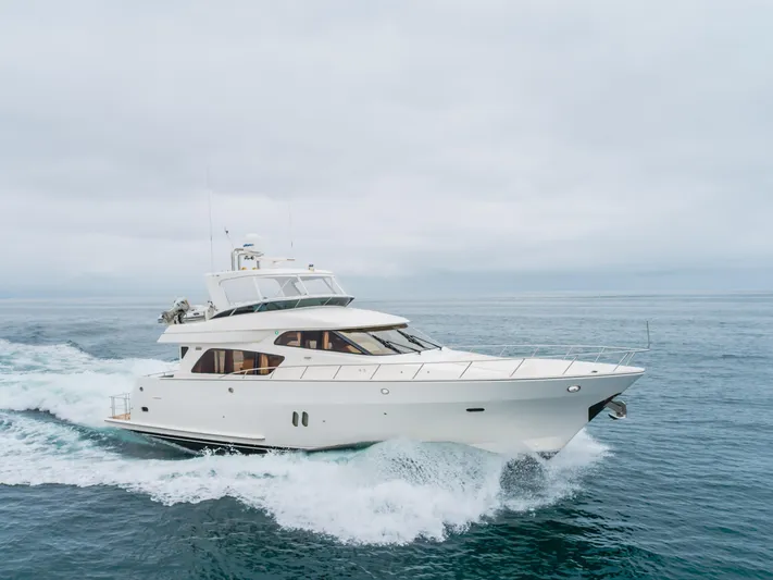 Oceana Yacht Photos Pics 2009 McKinna 60 Pilothouse yacht cruising on open sea under cloudy skies.