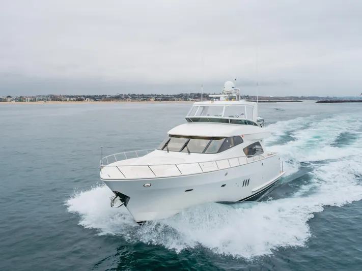 Oceana Yacht Photos Pics 2009 McKinna 60 Pilothouse yacht cruising on open water near coastline.