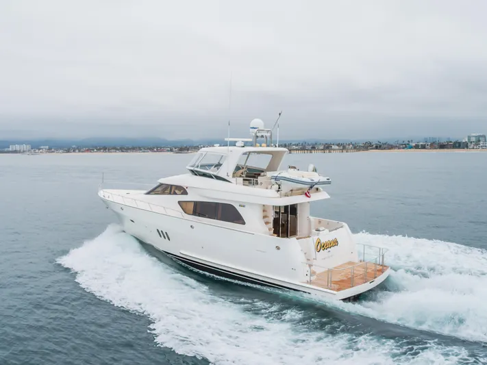 Oceana Yacht Photos Pics 2009 McKinna 60 Pilothouse yacht cruising on open water near coastline.