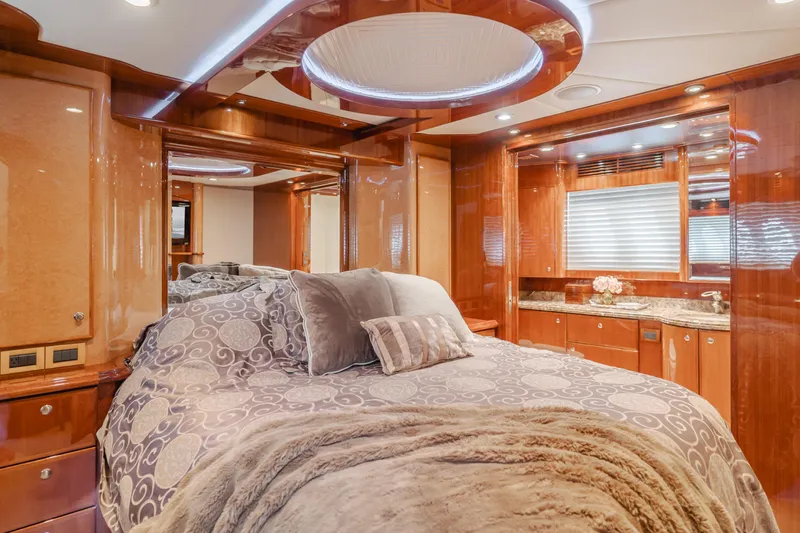 Oceana Yacht Photos Pics Luxurious bedroom interior of 2009 McKinna 60 Pilothouse yacht with elegant wood finishes.
