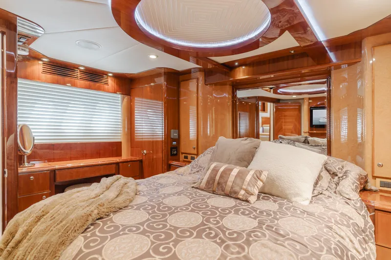 Oceana Yacht Photos Pics Luxurious bedroom interior of 2009 McKinna 60 Pilothouse yacht with elegant wood finishes.