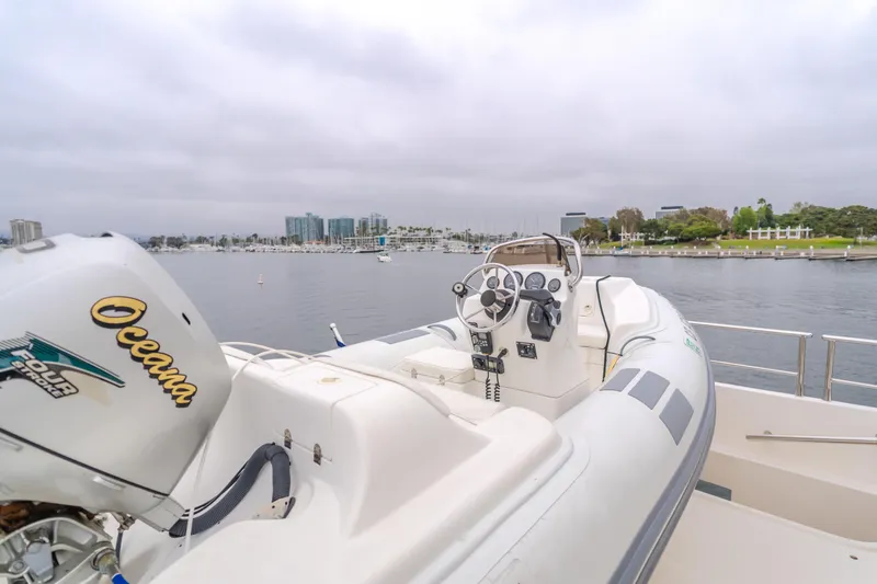 Oceana Yacht Photos Pics 2009 McKinna 60 Pilothouse yacht with inflatable boat on deck, overlooking marina.
