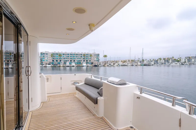 Oceana Yacht Photos Pics 2009 McKinna 60 Pilothouse yacht deck with marina view, featuring sleek design and comfortable seating.