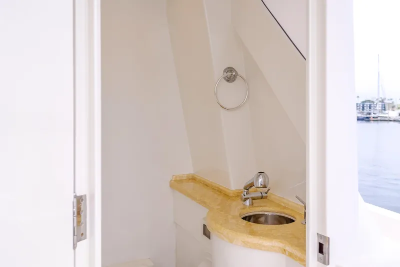 Oceana Yacht Photos Pics Luxurious bathroom on 2009 McKinna 60 Pilothouse yacht with elegant sink and countertop.