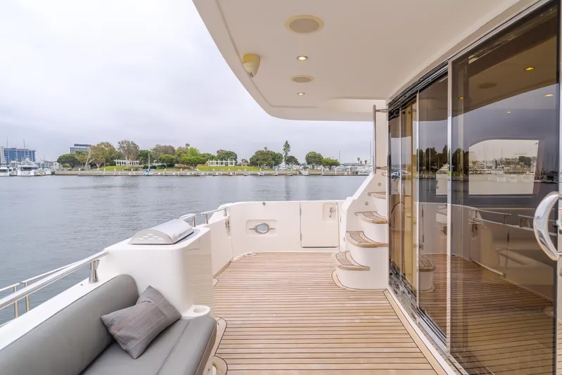 Oceana Yacht Photos Pics 2009 McKinna 60 Pilothouse yacht deck with seating, stairs, and waterfront view.