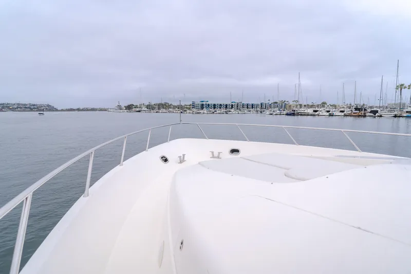 Oceana Yacht Photos Pics Bow view of 2009 McKinna 60 Pilothouse yacht in a marina setting.