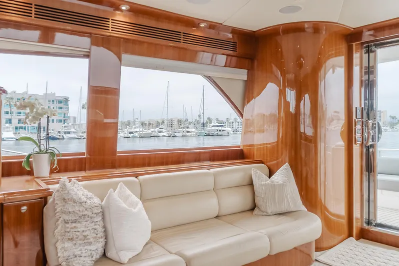 Oceana Yacht Photos Pics Luxurious interior of 2009 McKinna 60 Pilothouse yacht with plush seating and marina view.