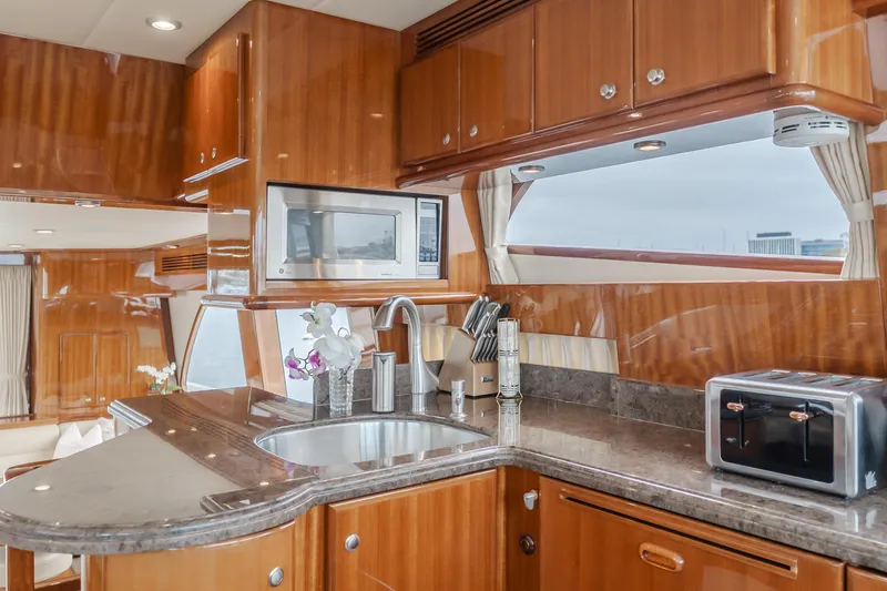 Oceana Yacht Photos Pics Luxurious kitchen interior of 2009 McKinna 60 Pilothouse yacht with modern appliances.