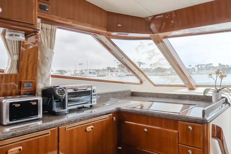 Oceana Yacht Photos Pics Luxurious 2009 McKinna 60 Pilothouse yacht kitchen with modern appliances and panoramic windows.