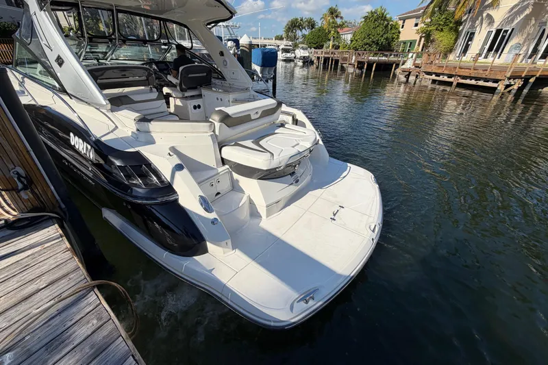 Dorita Yacht Photos Pics 2012 Monterey 400 Sport Yacht docked in a scenic waterfront setting.