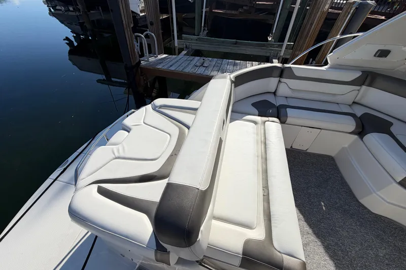 Dorita Yacht Photos Pics Luxurious seating on a 2012 Monterey 400 Sport Yacht docked by the water.