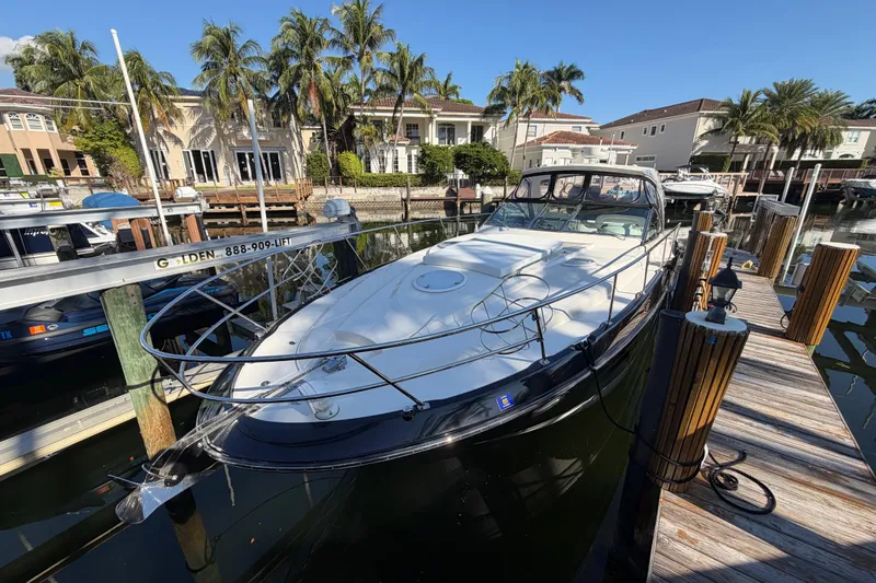 Dorita Yacht Photos Pics 2012 Monterey 400 Sport Yacht docked in a sunny marina setting.
