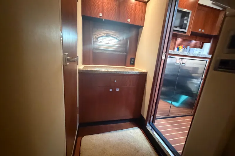 Dorita Yacht Photos Pics Interior of 2012 Monterey 400 Sport Yacht with wood cabinetry and stainless steel appliances.
