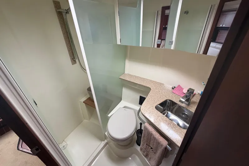 Dorita Yacht Photos Pics Bathroom interior of 2012 Monterey 400 Sport Yacht with shower, sink, and toilet.