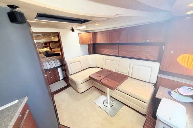 Dorita Yacht Photos Pics Interior of 2012 Monterey 400 Sport Yacht with beige seating and wooden accents.