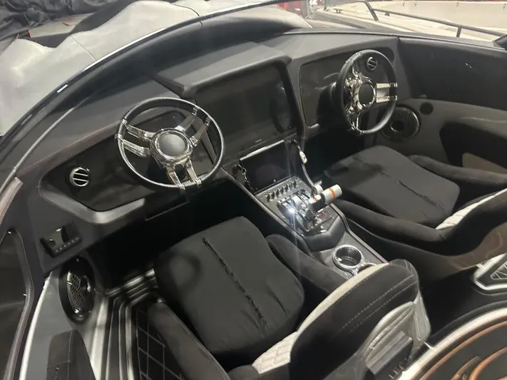  Yacht Photos Pics 2018 MTI 340X boat interior with dual steering wheels and modern dashboard design.