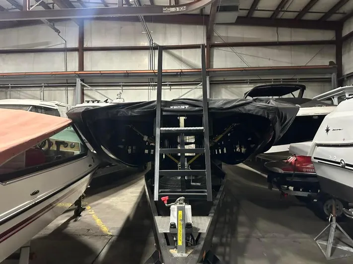  Yacht Photos Pics 2018 MTI 340X boat stored indoors, covered, with ladder access.