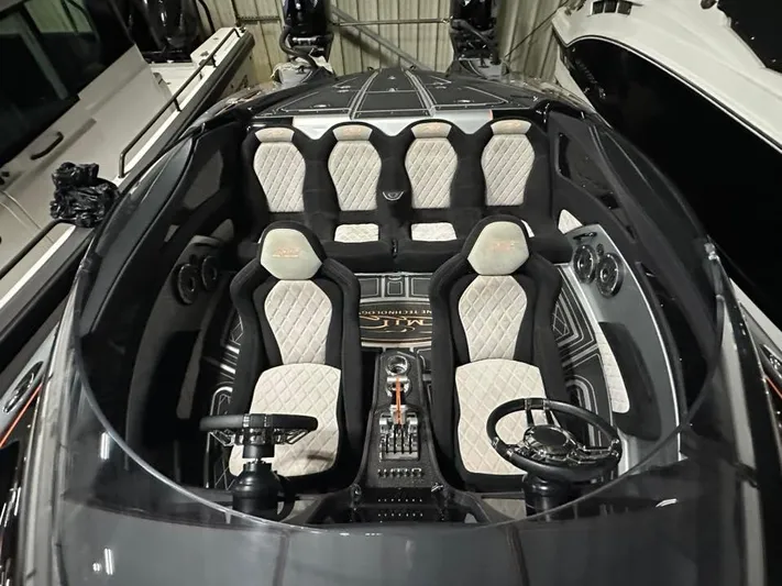  Yacht Photos Pics Interior of 2018 MTI 340X boat with luxury seating and dual steering wheels.