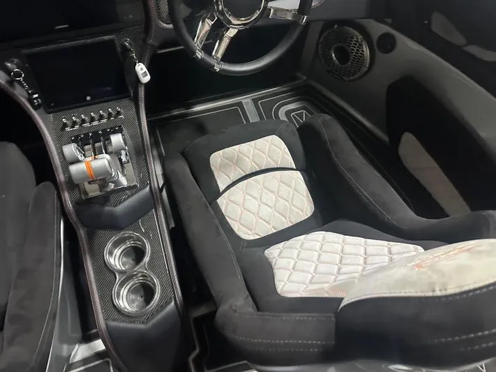  Yacht Photos Pics Luxurious MTI 340X 2018 interior with quilted seats, carbon fiber accents, and advanced controls.