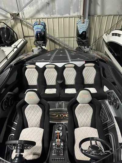  Yacht Photos Pics Luxury MTI 340X 2018 speedboat interior with plush seating and sleek design.