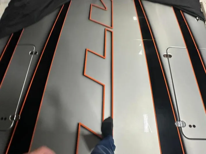  Yacht Photos Pics 2018 MTI 340X boat deck with sleek black and orange design accents.