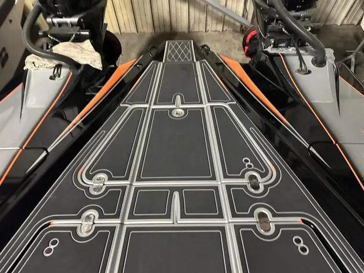  Yacht Photos Pics MTI 340X 2018 model boat deck with sleek black and orange design.