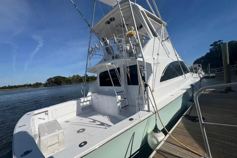 Top Pryority Yacht Photos Pics 1996 Ocean Yachts 48 Super Sport docked, showcasing sleek design and spacious deck.