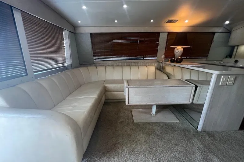 Top Pryority Yacht Photos Pics Luxurious interior of 1996 Ocean Yachts 48 Super Sport with plush seating and elegant decor.