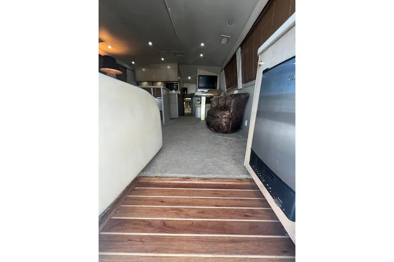 Top Pryority Yacht Photos Pics Interior of 1996 Ocean Yachts 48 Super Sport, featuring carpeted flooring and modern amenities.