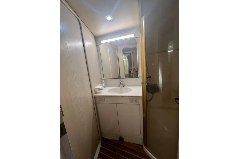 Top Pryority Yacht Photos Pics Bathroom interior of 1996 Ocean Yachts 48 Super Sport with sink and shower.