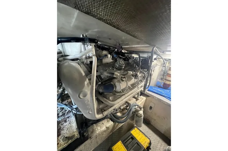 Top Pryority Yacht Photos Pics Engine room of 1996 Ocean Yachts 48 Super Sport, showcasing mechanical components.