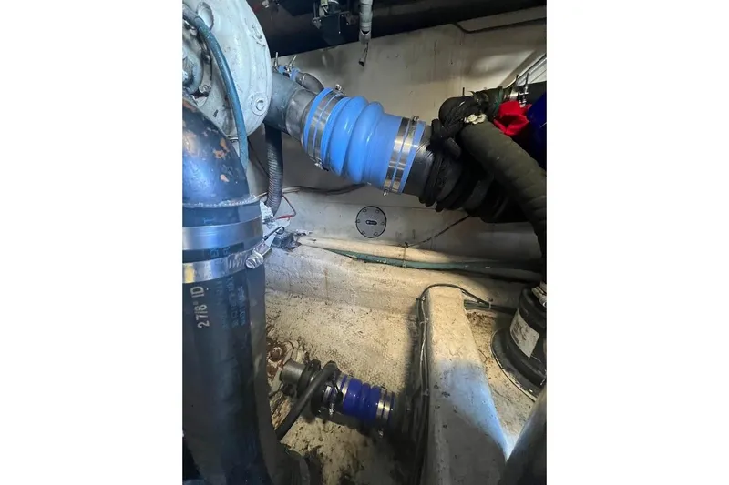 Top Pryority Yacht Photos Pics Engine room of 1996 Ocean Yachts 48 Super Sport, showing hoses and mechanical components.