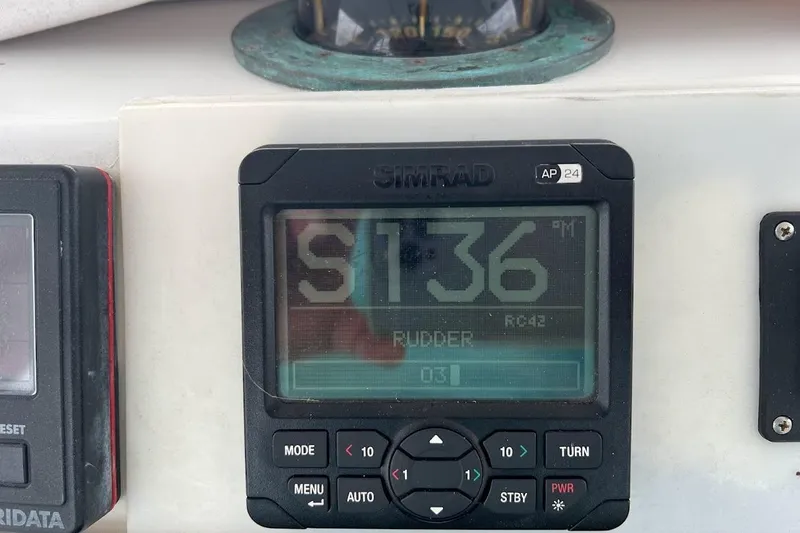 Top Pryority Yacht Photos Pics Simrad autopilot display on 1996 Ocean Yachts 48 Super Sport boat dashboard.
