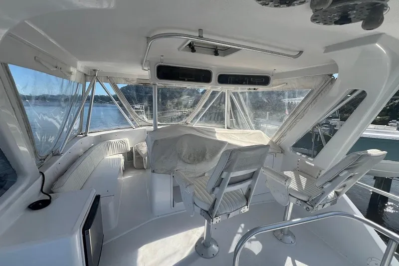 Top Pryority Yacht Photos Pics 1996 Ocean Yachts 48 Super Sport yacht interior with helm and seating area.