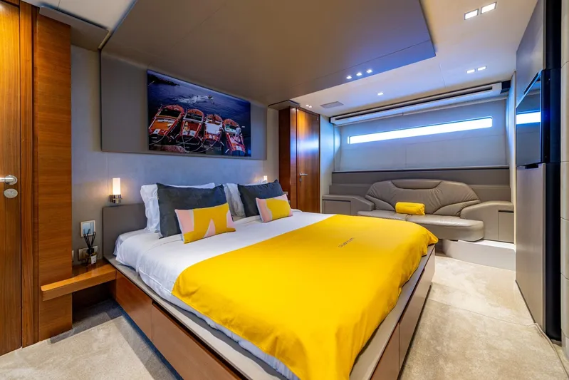 Quantum Yacht Photos Pics Luxurious 2007 Peri Yachts 29 bedroom with modern decor and vibrant yellow accents.
