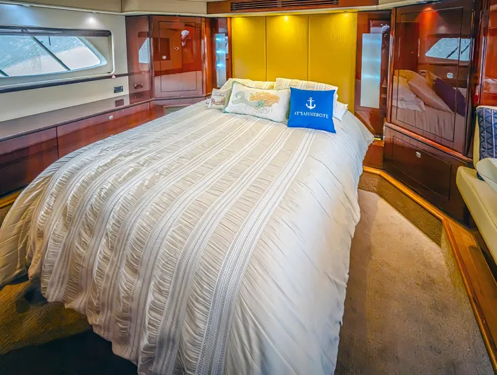 At's Ahmibote V Yacht Photos Pics Luxurious bedroom interior of 2011 Sea Ray 580 Sundancer yacht with elegant bedding.